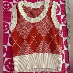 a orange sweater vest!